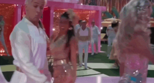 a man and a woman are dancing on a dance floor .