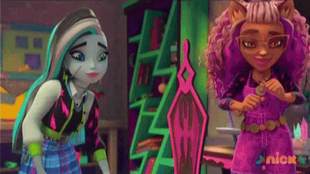 two monster high dolls are standing next to each other in a room