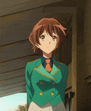 a girl with brown hair is wearing a green jacket and a blue tie