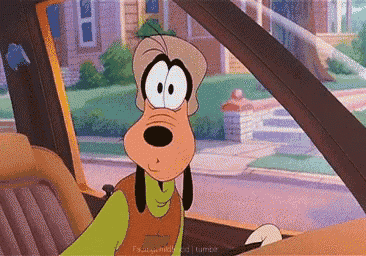 a goofy cartoon character is driving a car