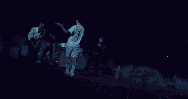 a group of people are standing in a cemetery with a grave that says ' a.c. smith ' on it
