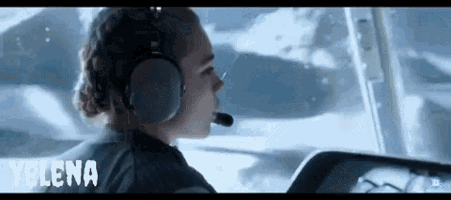a woman wearing headphones and a microphone with the name telena on the bottom right