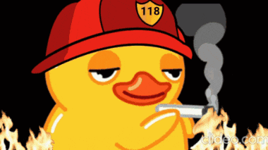 a yellow rubber duck wearing a fireman 's hat with the number 118 on it