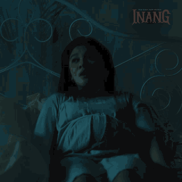 a poster for a movie called inang with a pregnant woman on it