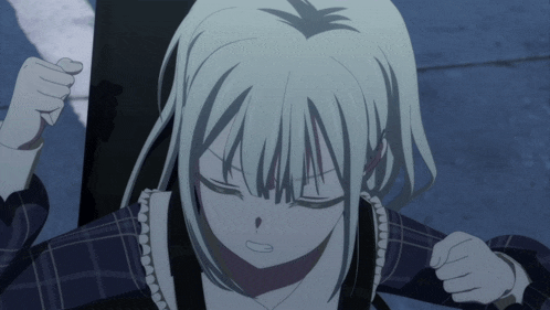 a girl with white hair has her eyes closed and her fist raised