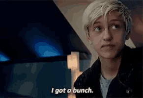 a young man says " i got a bunch " while wearing a leather jacket