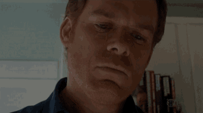a close up of a man 's face with a shocked look on his face