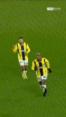 a soccer player with the number 94 on his shorts is running on a field