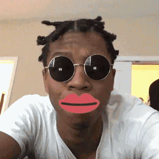 a man wearing round sunglasses and a red lip makes a funny face
