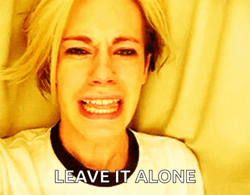 a woman is crying with the words " leave it alone " below her