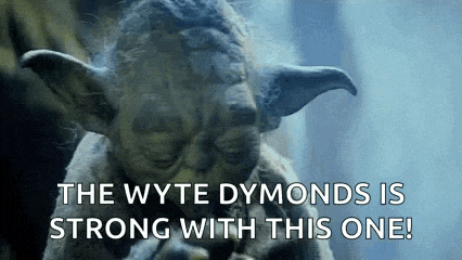 a close up of a statue of yoda saying `` the wyte dymonds is strong with this one '' .