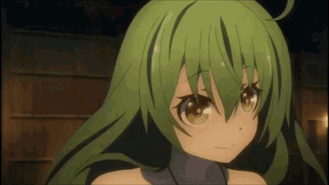 a close up of a green haired anime girl with yellow eyes .