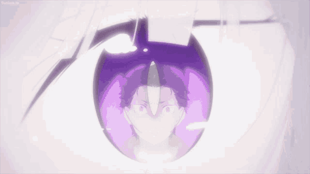 a close up of a person 's eye with a purple glow