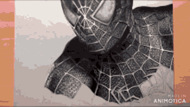 a black and white drawing of a spider man with the words made in animatica on the bottom