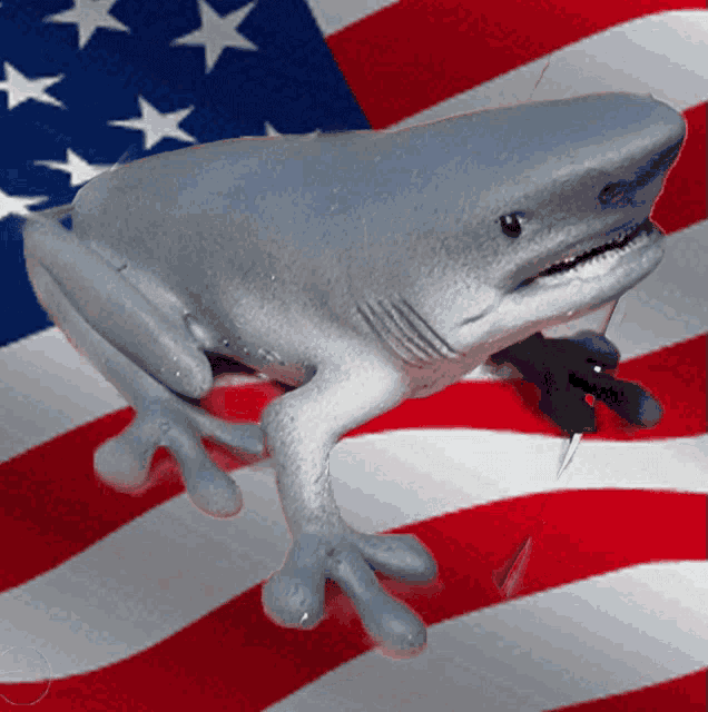 a frog with a shark head is holding a knife in its mouth in front of an american flag