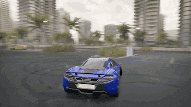 a blue sports car is driving down a street