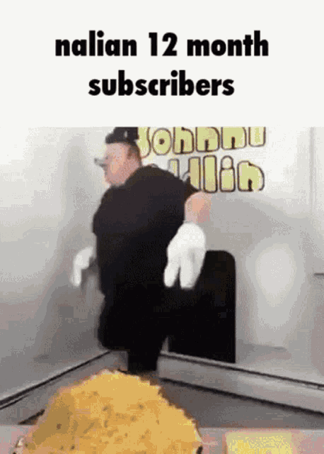 a man in a black shirt and white gloves is standing in front of a pile of food with the caption nalian 12 month subscribers