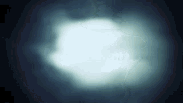 a dark background with a white light coming out of it