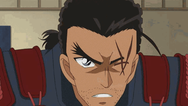 a close up of a man 's face with a cross on his face