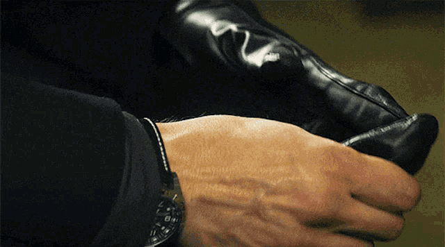 a close up of a person 's wrist with a watch on it