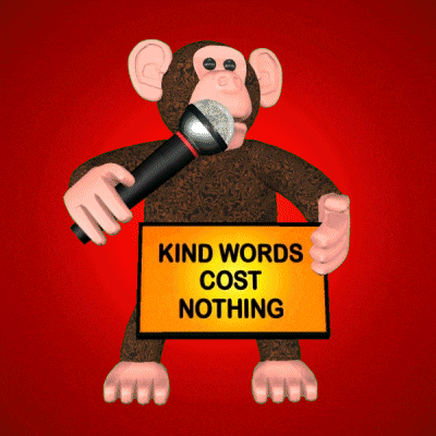 a chimpanzee holding a microphone and a sign that says kind words cost nothing