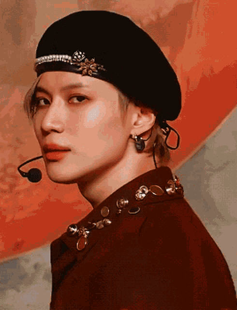 a close up of a person wearing a black beret