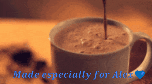 a cup of coffee with the words made especially for alex in blue