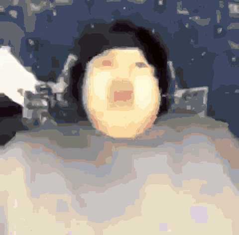 a pixelated image of a person 's face with a huge mouth open