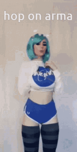 a woman with green hair is wearing a nasa sweater and shorts