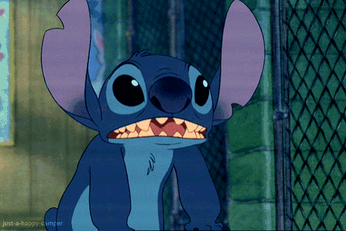 a close up of a cartoon character with the words just-a-happy-camper below it