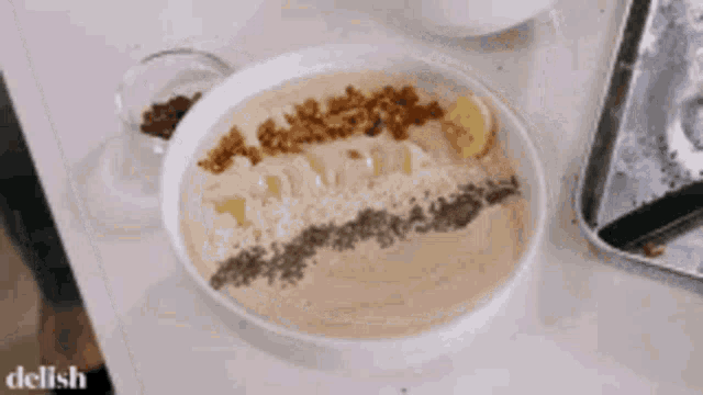a bowl of food is on a table with the word delish on the bottom