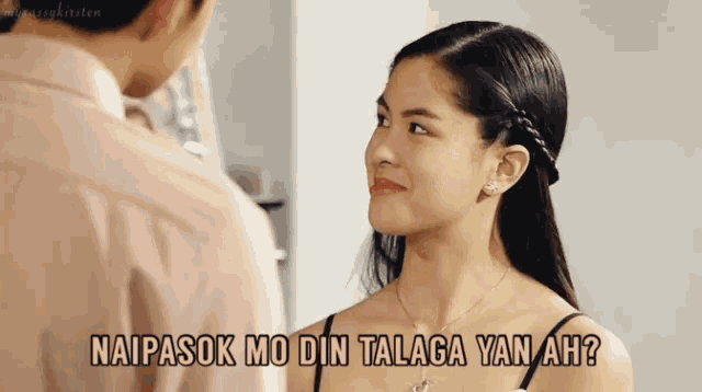 a man and a woman are looking at each other with the words naipasok mo din talaga yan ah written above them