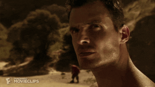 a movie clip of a man breaking a rock