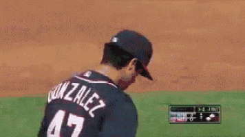a baseball player with the name gonzalez on the back of his shirt