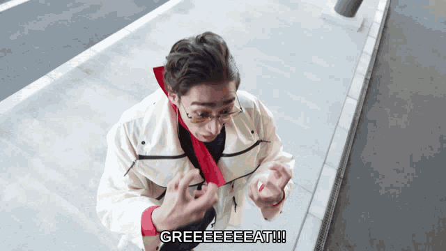 a man wearing glasses and a white jacket says greeeeeeat !!!