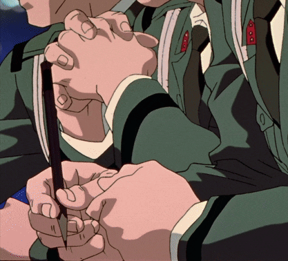 a close up of a person 's hands holding a stick