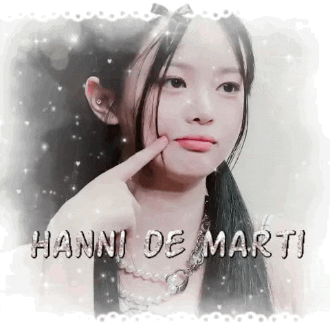 a young girl with long hair and a pearl necklace is wearing a ponytail and touching her face .