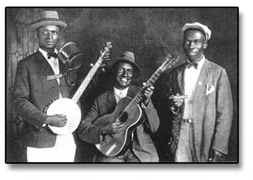 three men are standing next to each other holding instruments .