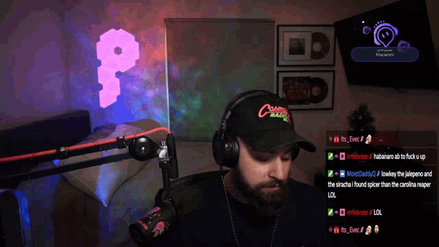 a man wearing a hat that says crunchy jalapenos on it