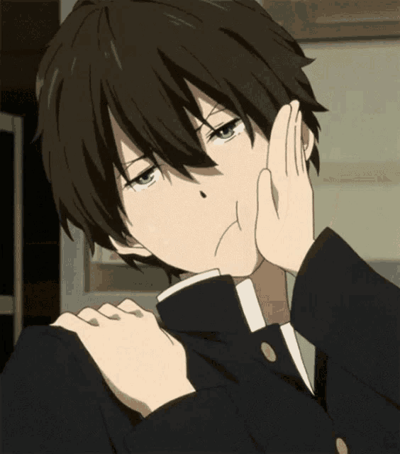 a close up of a person with a hand on their face