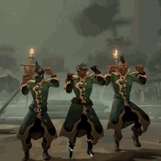 three men in green robes are holding torches and flags