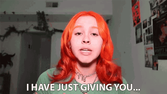 a girl with red hair and a green shirt says i have just giving you
