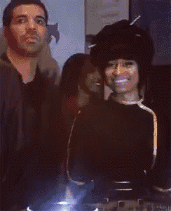 a man and woman are standing next to each other