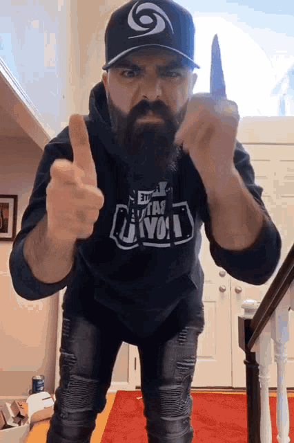 a man with a beard wearing a shirt that says i am revol