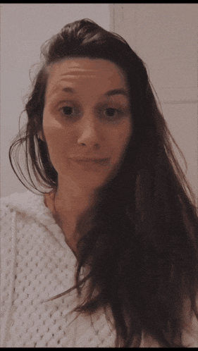 a woman in a white sweater says love