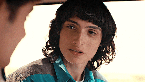 a close up of a person 's face with freckles