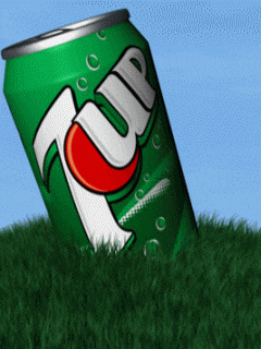 a green can of 7 up sits in the grass against a blue sky