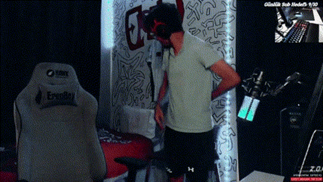 a man in a white shirt is standing in front of a white chair that says eagull on it