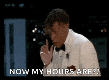 a man in a tuxedo is smoking a cigarette and saying " now my hours are " .