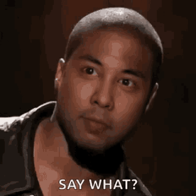 a man with a beard is saying `` say what '' .